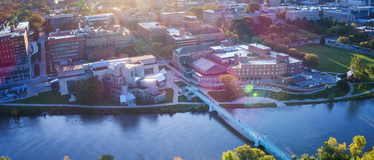 alt="An ariel view of campus buildings along the Iowa River."