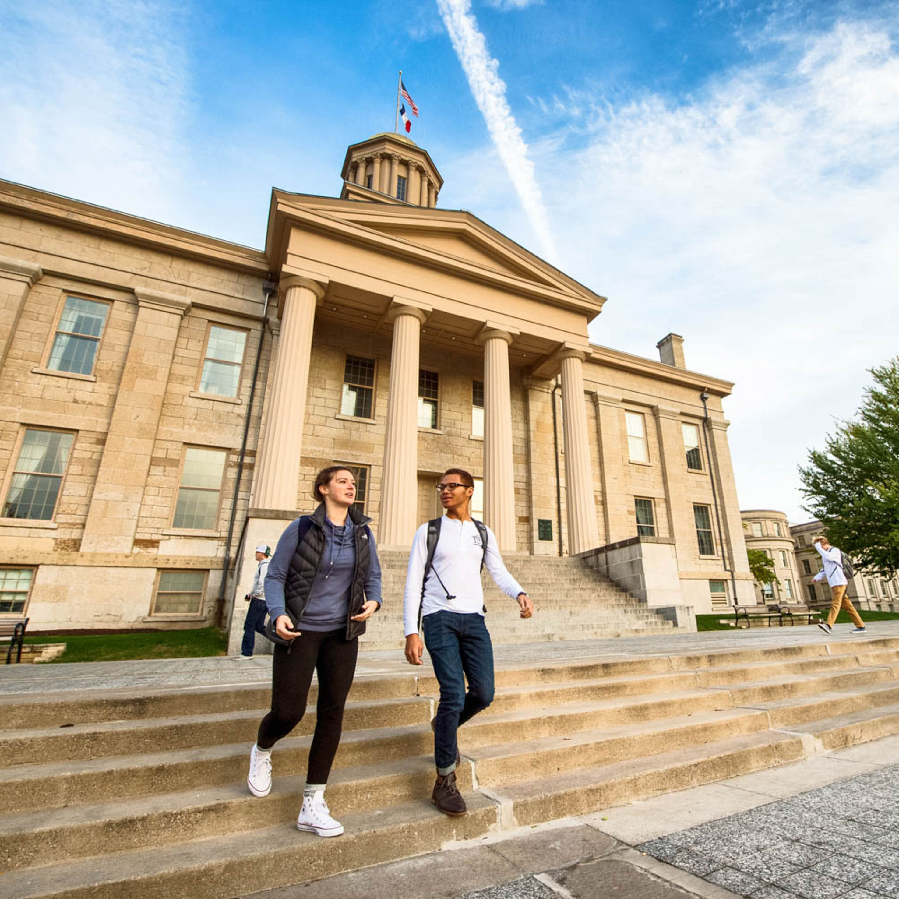 students-walking-down-stairs-of-old-cap