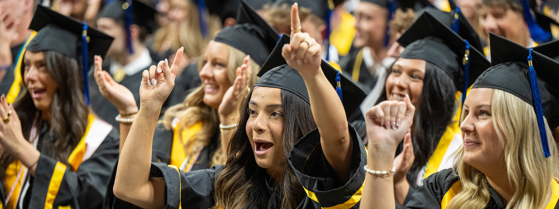 a grad celebrating at commencement