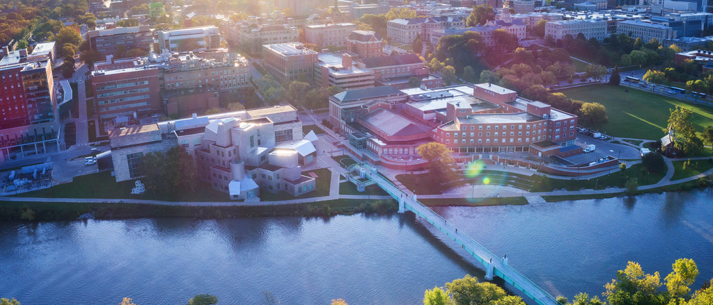 alt="An ariel view of campus buildings along the Iowa River."