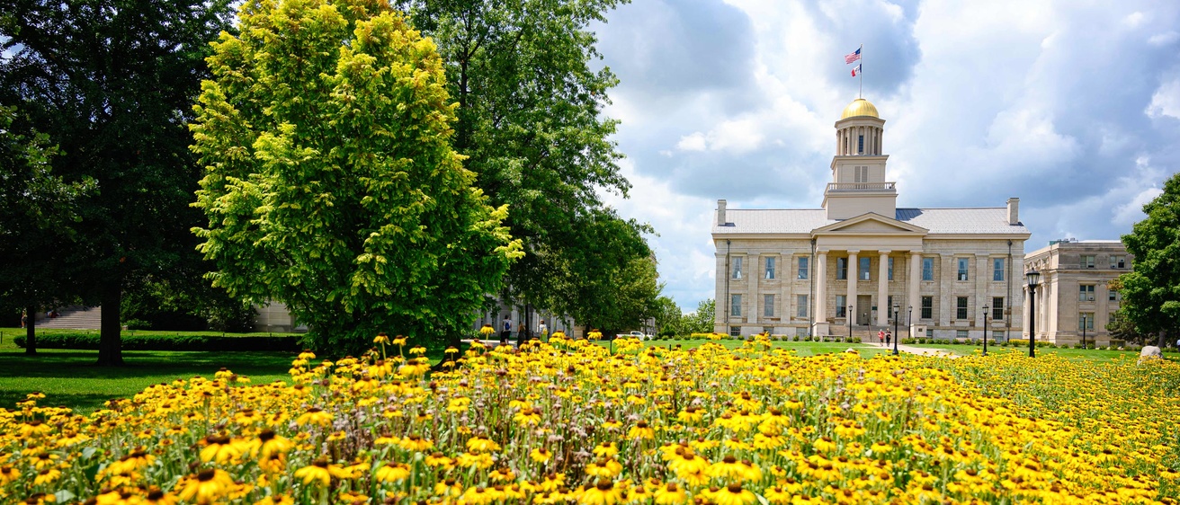 Old Capitol with flowers in the foreground.