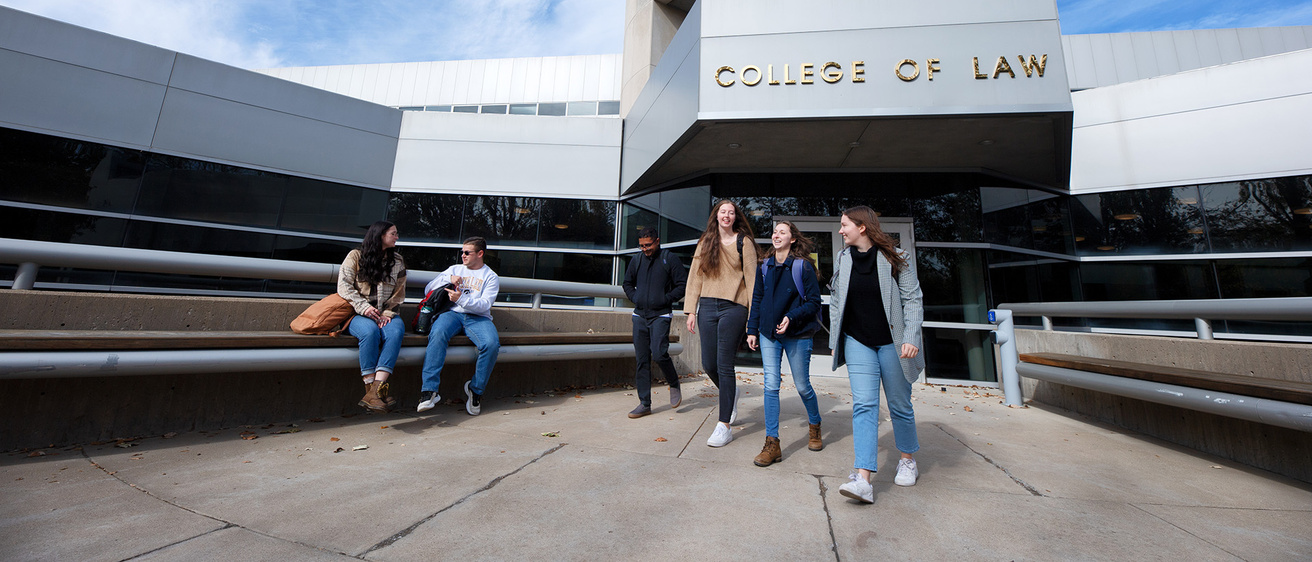 people outside the Boyd Law Building on the University of Iowa campus