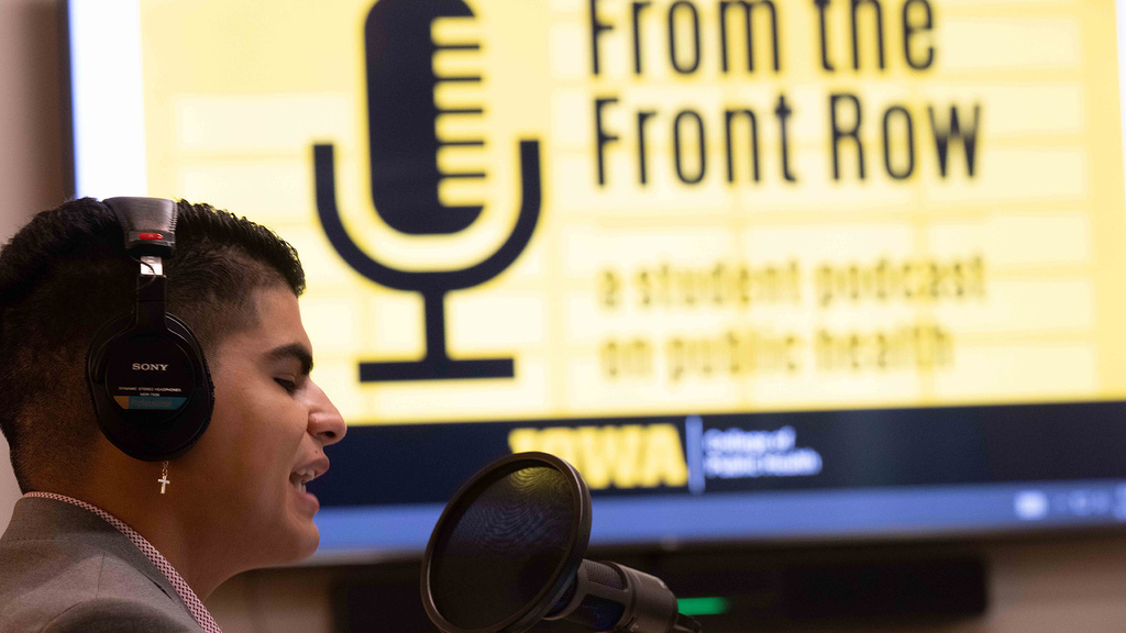 a student records an episode of the From the Front Row podcast