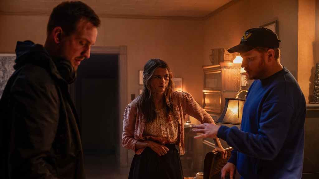 directors and an actor on the set of the movie Heretic
