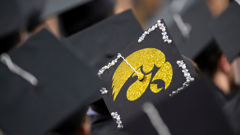 Hawkeye logo emblazoned on Iowa graduates' cap