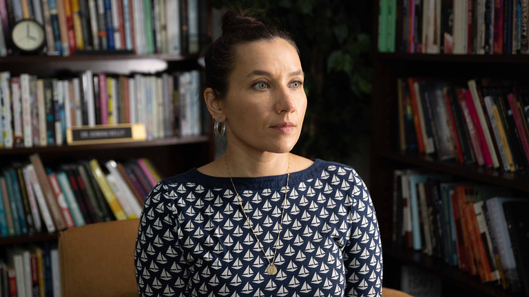 University of Iowa faculty member Melissa Febos in a library setting
